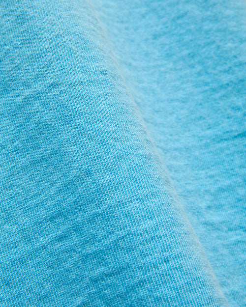 Stand Wheeler Pigment-Dyed T-Shirt in Light Blue