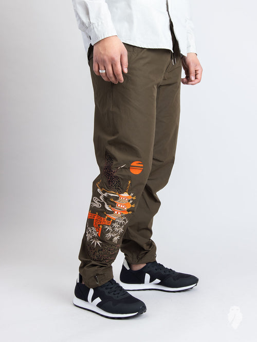 Crane Woven Trackpants in Maha Olive